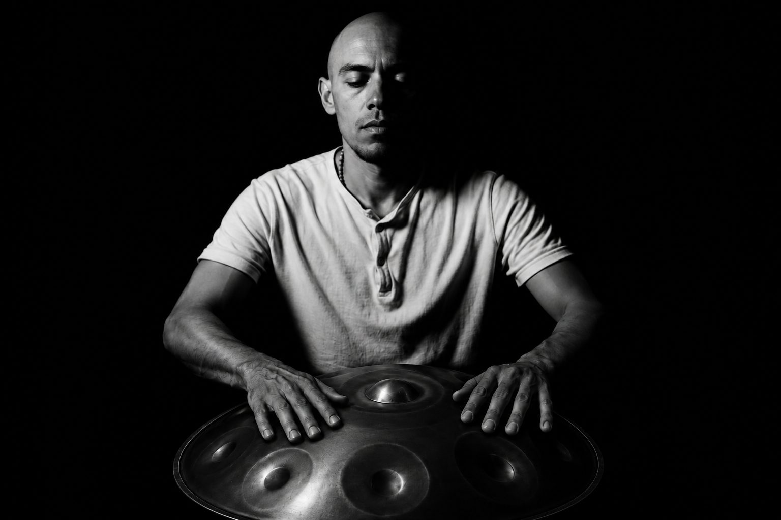 Israel, handpan maker of SHIVAPAN, playing one of his handpans in Tulum, México